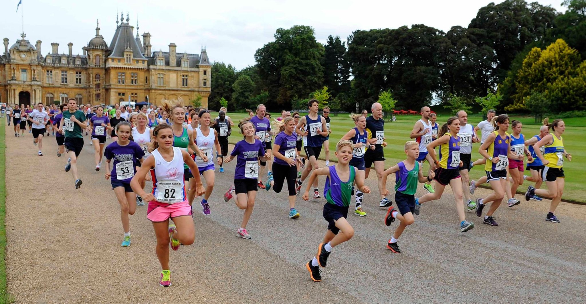 Road runners with a manor in background